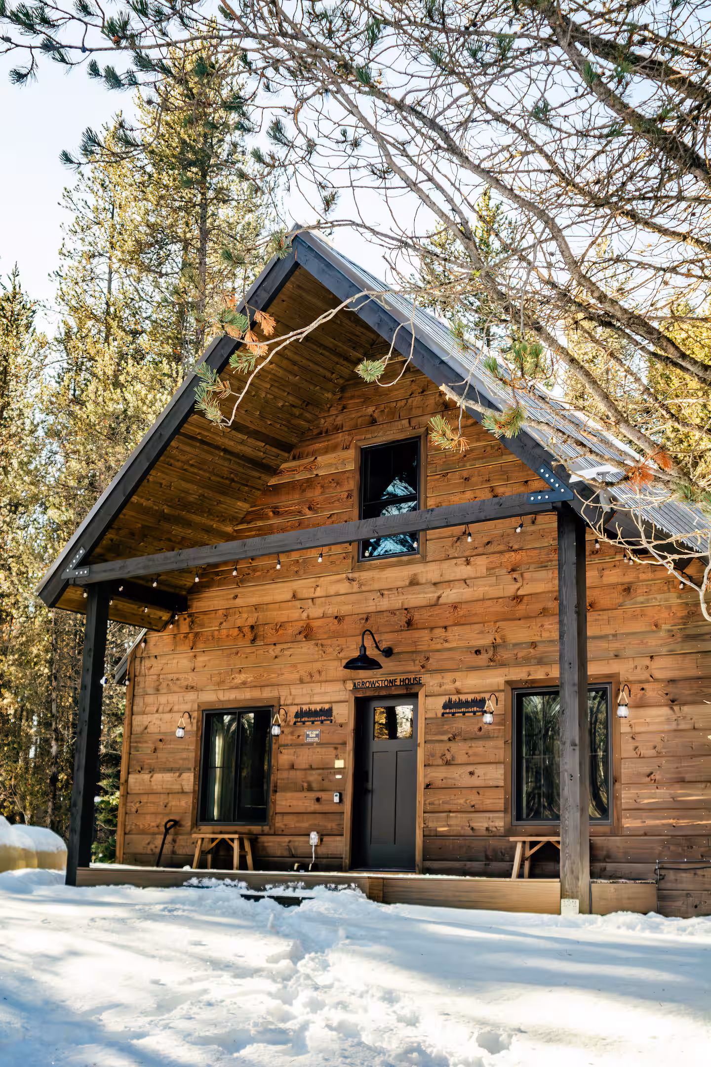 Arrowstone House in fresh snow among the lodgepole pines