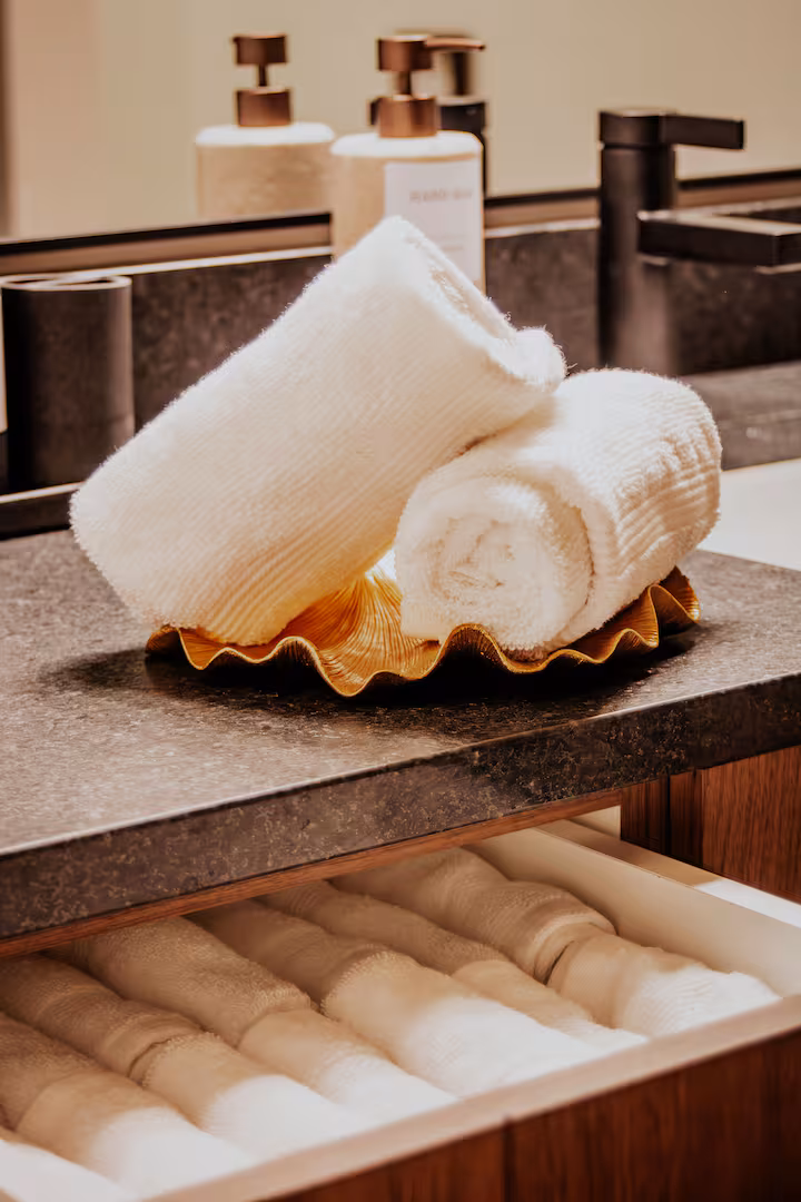 Rolled towels on the soapstone counter